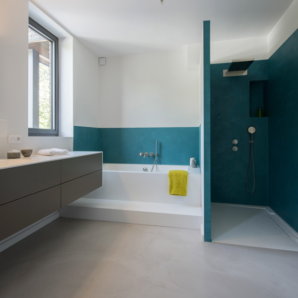 Bathroom with decorative concrete on floor and walls